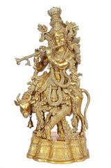 Brass standing Krishna with cow statue, front view with detailed armor and halo