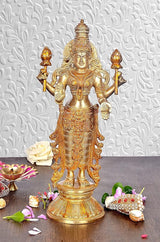 Gold-tone Vishnu idol statue, front view with four spear-like emblems in hands