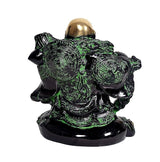 Back view of laughing Buddha statue, dark robe with green swirl patterns, gold head