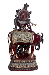 Brass Krishna cow murti, back view of maroon cow, detailed embossed panels