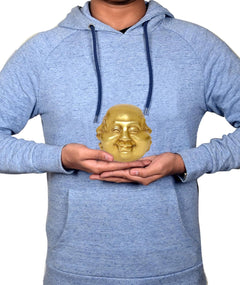 Brass laughing Buddha head held in hands, 4 inch home decor size