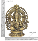 Brass Ganesha idol size view, seated with ornate halo; 10 in height measurement