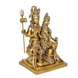 Brass seated deity family statue with Shankar holding trident and Ganesha in front