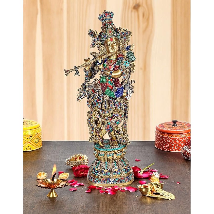 Brass Krishna murti with flute, ornate multicolor headdress and detailed jewelry