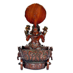 Brass sun chariot statue back view with large sun disk and ornate base, brown.