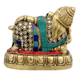 Brass resting Ganesha idol, back view, patterned blue bands and circular white accents, 4 in