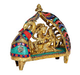 Brass Radha Krishna idol statue, front-left view with jeweled multicolor arch