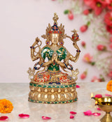 Tara Devi brass idol, seated with four arms, green sari and gold base, painted gems
