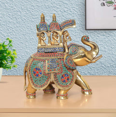 Brass king riding elephant statue, gold elephant with red, blue, and green jewel-like inlay
