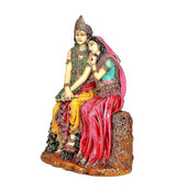 Resin Radha-Krishna idol, side view with pink veil, teal trim, and red draped garment
