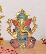 AONA gold Ganesha idol statue, turquoise crown and red gemstone-studded robe