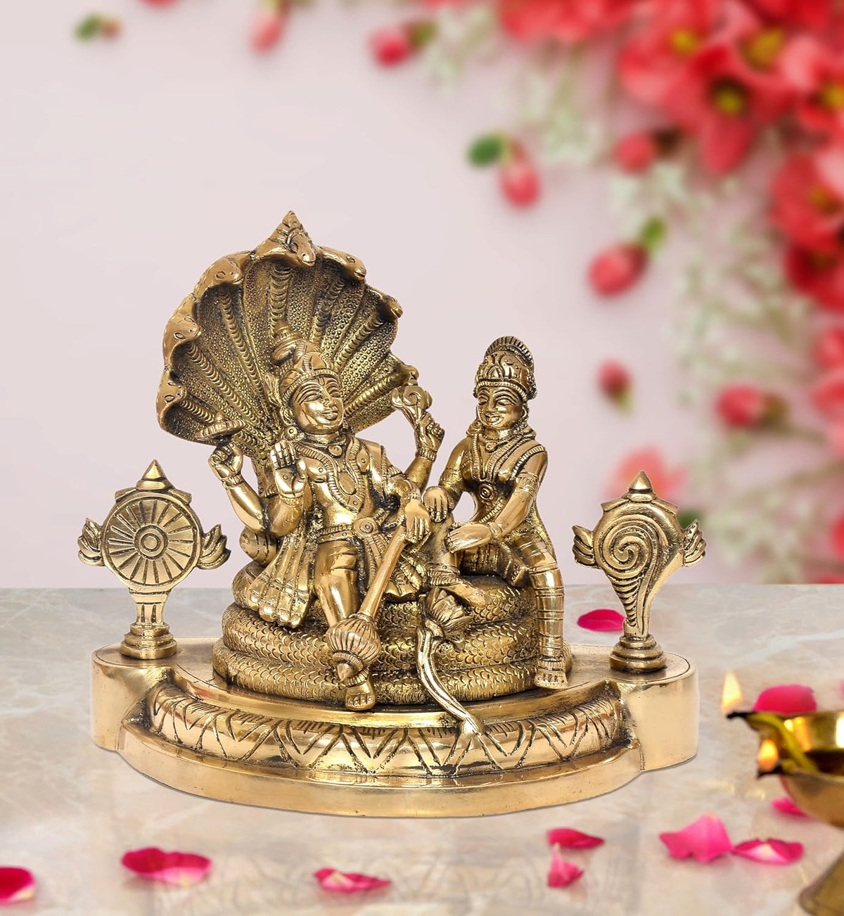 Brass Maa Lakshmi idol with Lord Vishnu on Sheshnag, gold tone on round base