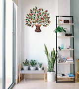 Iron tree wall hanging with multicolor leaves on bronze base, centered on wall