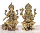 Brass-finish Lakshmi and Ganesh duo, seated on lotus bases with decorative ornaments