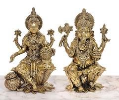 Brass-finish Lakshmi and Ganesh duo, seated on lotus bases with decorative ornaments