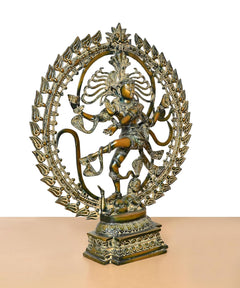 Brass Natraj Lord Shiva idol, three-quarter view showing dancing stance and halo ring