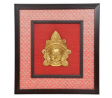 Brass Maa Durga face idol wall hanging with ornate gold Durga head relief on red inner frame