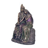 Side view Radha-Krishna resin statue, flowing purple and green drapes on base