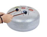 Silver steel happy drum with wooden rubber mallets touching tone heads