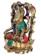 Lakshmi statue with multicolour mosaic sari on golden lotus base, side view with elephants