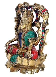 Lakshmi statue with multicolour mosaic sari on golden lotus base, side view with elephants