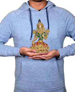 Brass Tara Devi statue held in hands, seated goddess figure with green-and-red attire