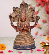 Bronze Patanjali statue with multi-armed cobra canopy, seated in meditative pose