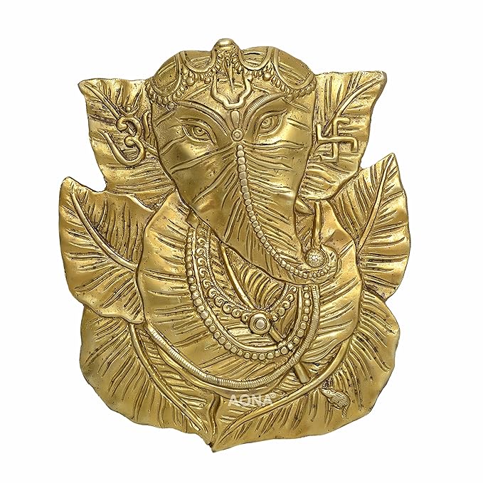 Brass Ganesha wall hanging with pipal leaf halo, ornate jewelry and crown