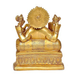 Brass Ganesha statue rear view with circular halo and detailed seat