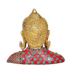 Brass Buddha bust back view, patterned gold crown and jeweled red outfit with colorful gems