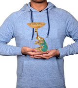 Golden elephant dry fruit bowl showpiece held in hands on a blue hoodie, fluted tray