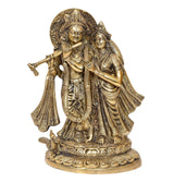 Brass Radha Krishna idol statue, front view of seated couple on detailed base
