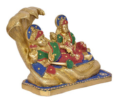 Brass Lakshmi and Vishnu sitting on Sheshnag base, jeweled crowns and robes