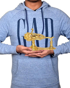 Brass peacock aarti diya oil lamp held in hands, multi-bowl design with central peacock figure