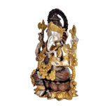 Brass Ganesha idol, close angle, four arms, dark brown and gold accents