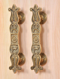 Golden brass main door handle pair with embossed floral scroll pattern