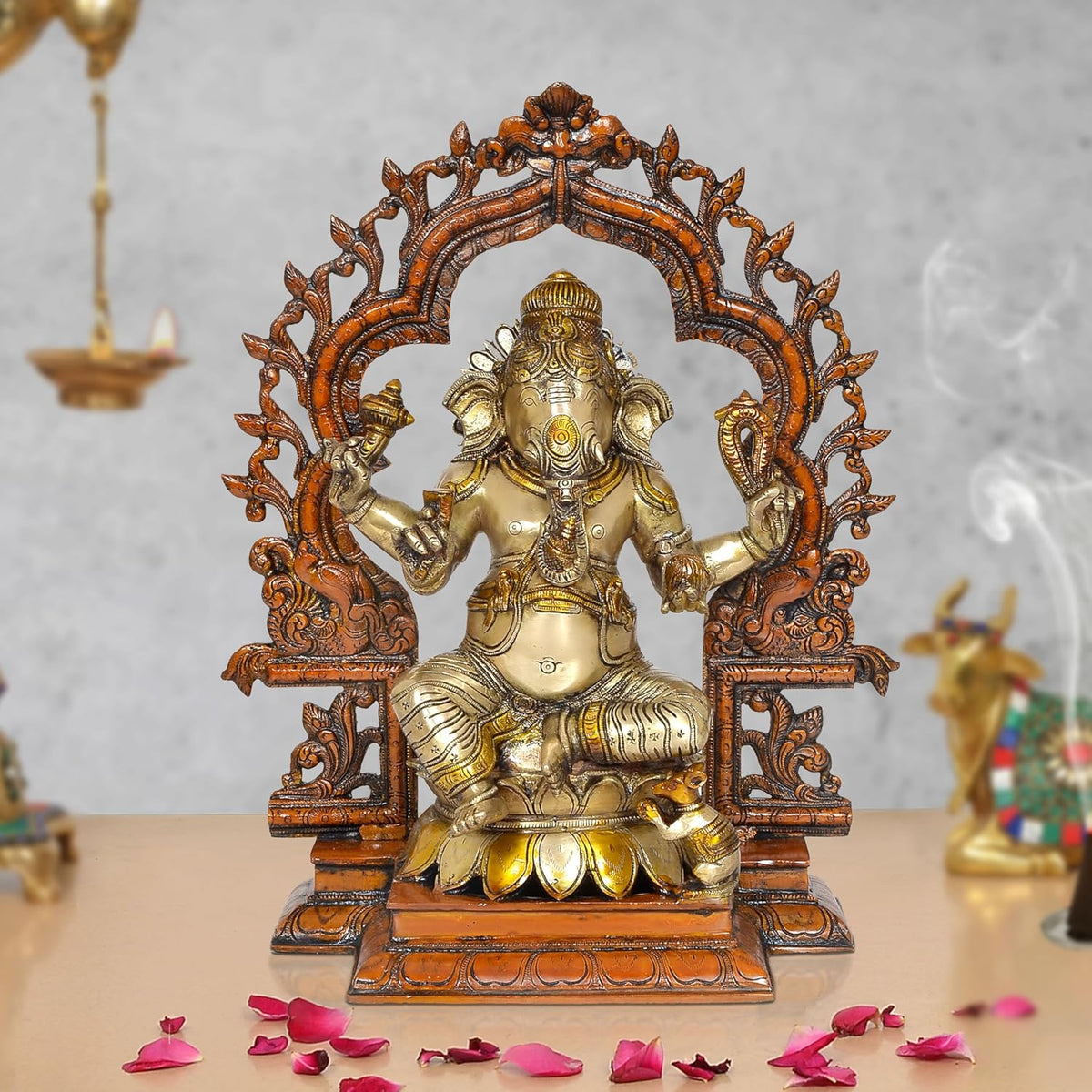 Brass Lord Ganesha idol, seated with ornate arch backdrop, 15.5 in height