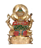 Back view of brass Ganpati murti seated on lotus base, multicolor patterned lower garment