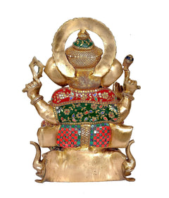 Back view of brass Ganpati murti seated on lotus base, multicolor patterned lower garment