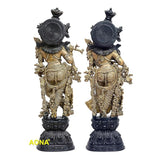 Brass Radha Krishna sculpture seen from back, circular ornaments on pedestal