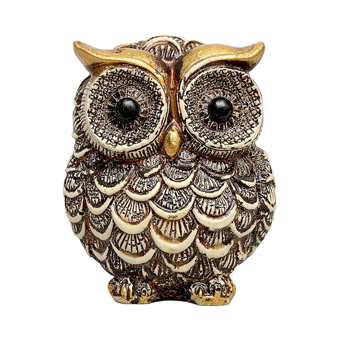 Polyresin owl statue in white with gold accents, detailed feather pattern and eyes.