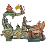 Brass chariot statue with Krishna, Arjuna, and horse team, ornate base and wheels.