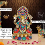 Brass Ganesha statue front view, multicolor beadwork on lotus base