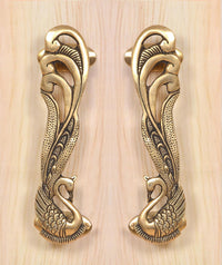 Peacock brass door handle pair, detailed leaf and bird motifs on two handles