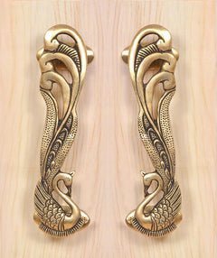 Peacock brass door handle pair, detailed leaf and bird motifs on two handles