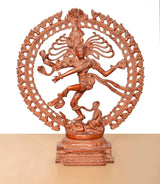 Lord Shiva dancing brass statue on pedestal, orange, framed by an ornate circular arch