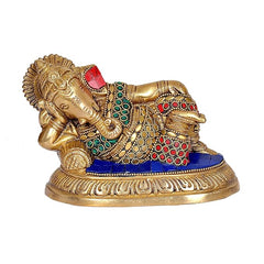 Brass Ganesha statue resting pose, patterned tunic with red dots and blue base