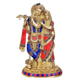 Radha Krishna brass figurine on round base, blue and red decorated clothing