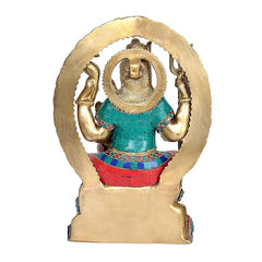 Brass Shiva statue from back, raised hands and teal/red draped cloth