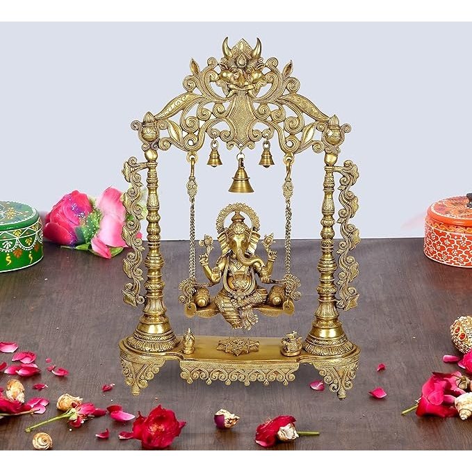 Brass Ganesha swing with ornate frame and three hanging bells, 26 in height